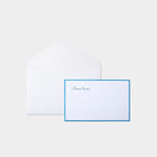 Carte festive motif bonne année bleu et son enveloppe assortie blanche