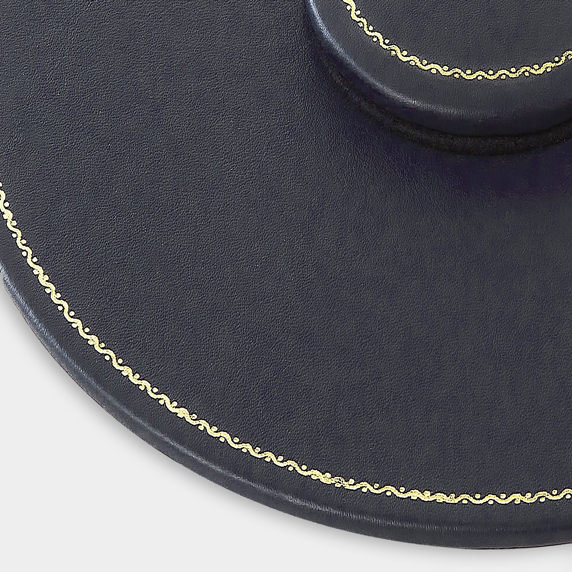 Zoom plan de table en cuir rond bleu marine Benneton Graveur